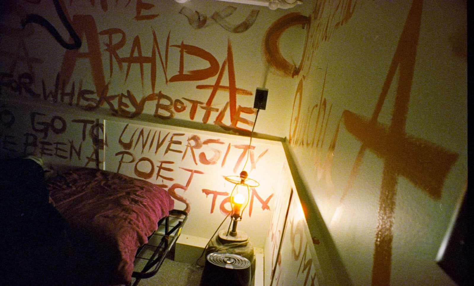 Wall covered in orange graffiti and writing — Photo by Austin on Unsplash
