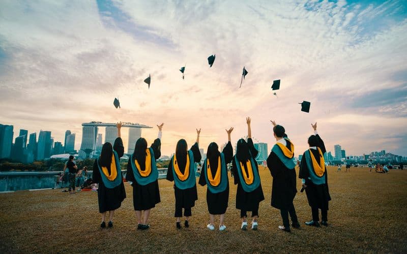 people throwing hats on air — Photo by Pang Yuhao on Unsplash