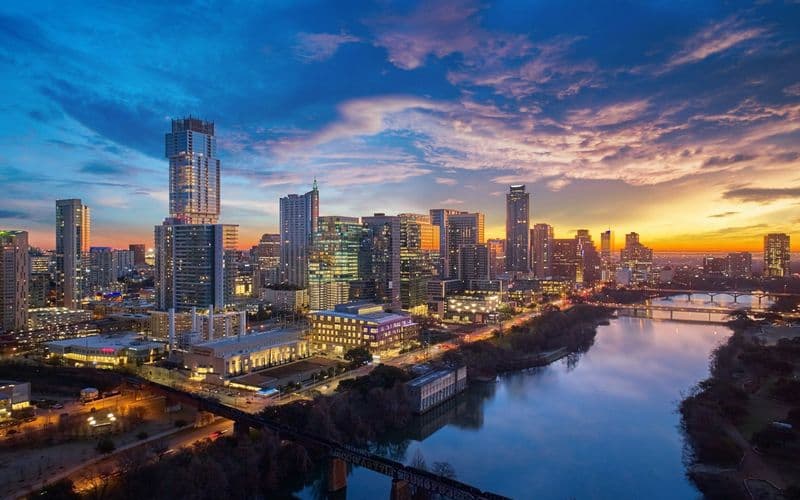 a city skyline at sunset — Photo by Justin Wallace on Unsplash