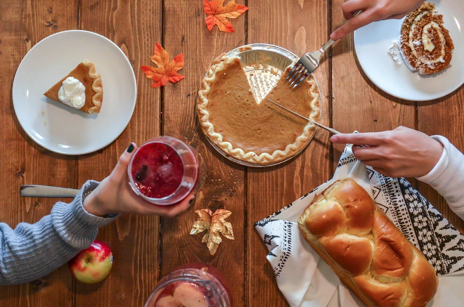 person slicing pie beside bread — Photo by Element5 Digital on Unsplash