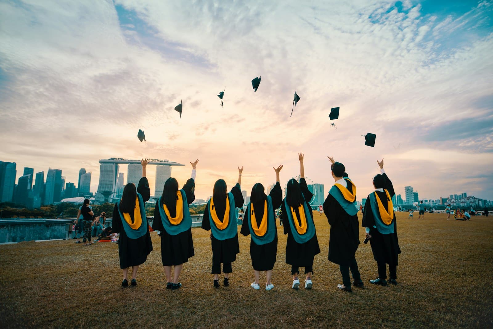 people throwing hats on air — Photo by Pang Yuhao on Unsplash